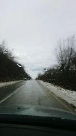 Road seen through car windshield