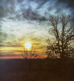 Scenic view of landscape against cloudy sky
