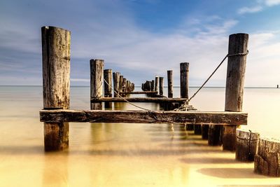 Pier over sea against sky