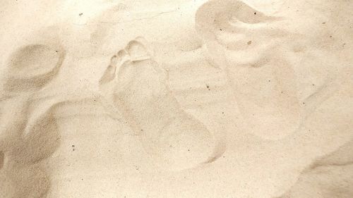 Footprints on sandy beach