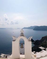 Scenic view of sea by building against sky