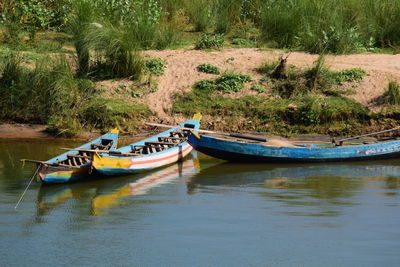 Boat moored in river