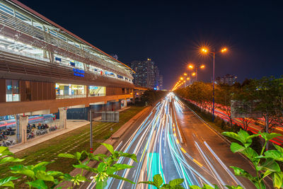 High angle view of light trails on road at night