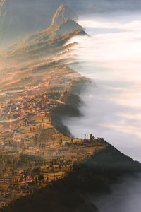 High angle view of sea and cityscape against sky