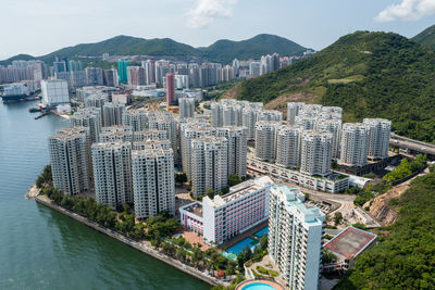 High angle view of buildings in city against sky