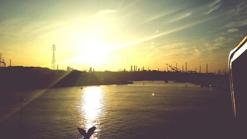 Sun shining over river