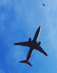 Low angle view of airplane flying in sky