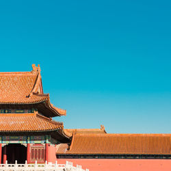 Low angle view of building against clear blue sky