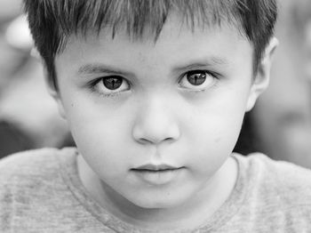 Close-up portrait of cute boy outdoors