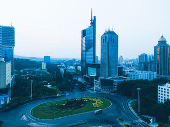 Modern buildings in city against sky