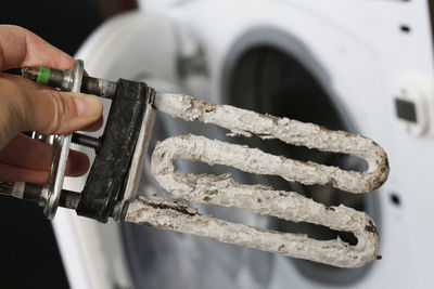 Close-up of man working on metal