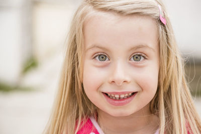 Close-up portrait of smiling girl