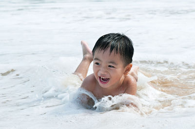 Portrait of smiling boy on beach