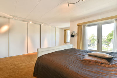 View of cozy bed in bedroom