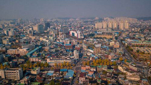 Aerial view of cityscape against clear sky