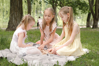Side view of couple standing on field