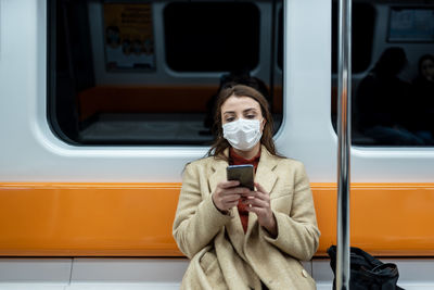Portrait of man holding train