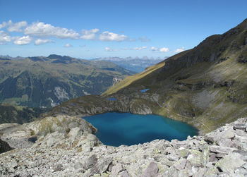 Scenic view of lake and mountains against sky