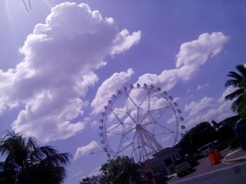 Low angle view of ferris wheel against sky