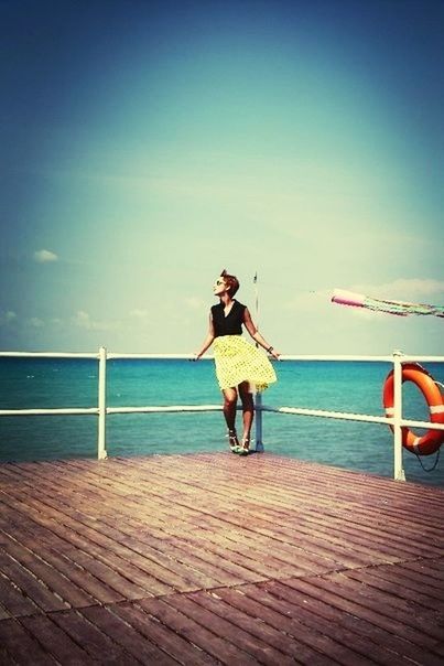 sea, horizon over water, full length, sky, water, leisure activity, lifestyles, rear view, beach, casual clothing, tranquility, tranquil scene, pier, standing, scenics, person, shore, railing