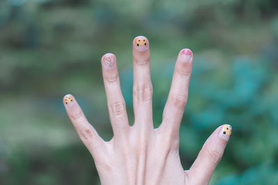Cropped woman hand showing nail polish