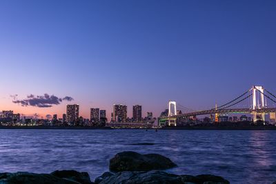 Illuminated tokyo bay at night