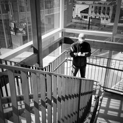 Woman standing on footbridge