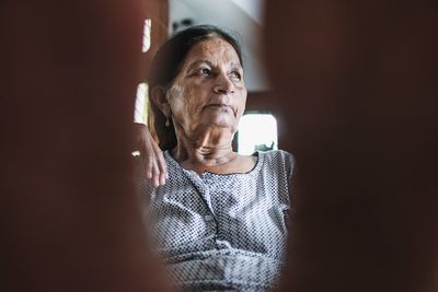 Close-up of senior woman looking away