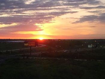 Scenic view of landscape against sky during sunset