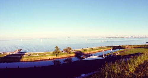 Scenic view of calm sea against clear sky