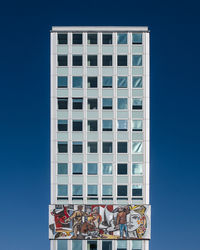 Low angle view of building against clear blue sky