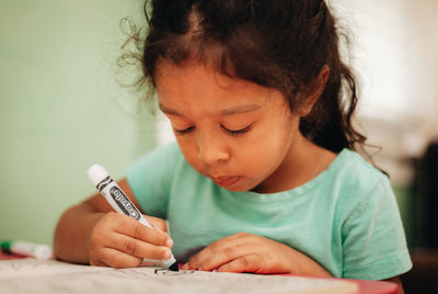 Portrait of girl looking at table