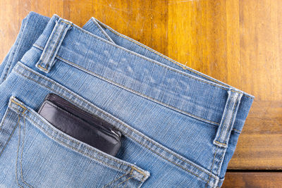 Close-up of leather on table against blue background