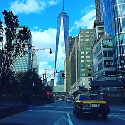 City street against cloudy sky