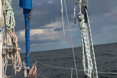 Sailboat sailing on sea against sky