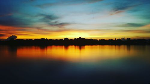 Scenic view of lake against sky during sunset