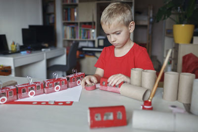 Portrait of boy playing with toy blocks on table