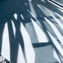 High angle view of shadow on road in city