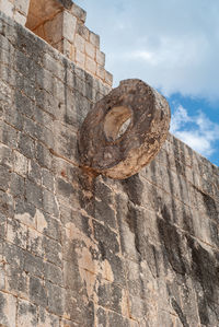 Low angle view of stone wall