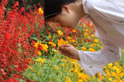 Woman smelling flowers