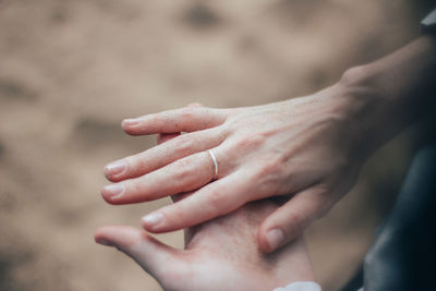 Close-up of couple holding hands