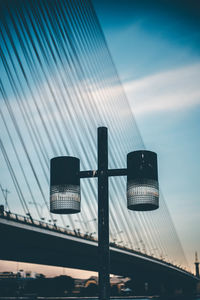 Low angle view of road signal against sky