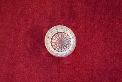 High angle view of drink on red table
