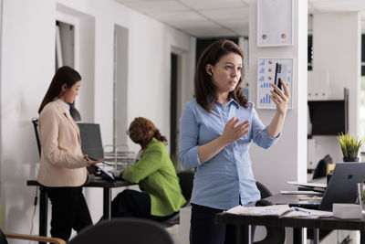 Business colleagues working in office