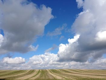 Scenic view of landscape against cloudy sky