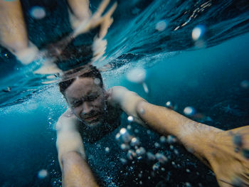 Man swimming in undersea