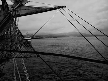 View of fishing net in sea against sky