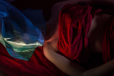 High angle view of woman sleeping on bed