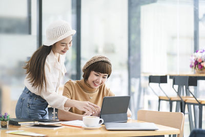 Young woman working with laptop on table