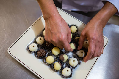 Close-up of hand holding ice cream
